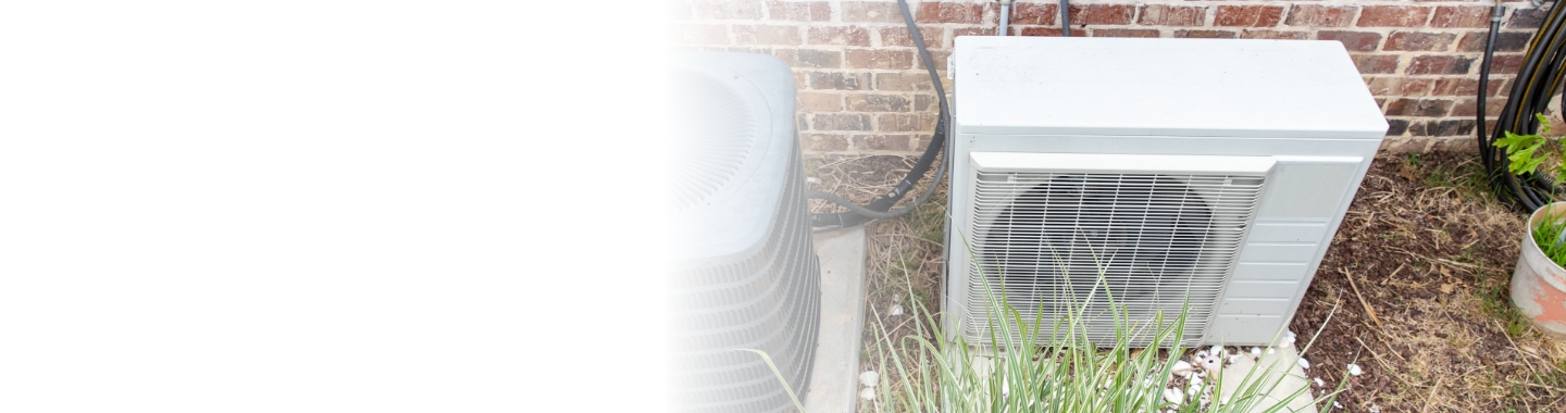 Air source heat pump outside of a house